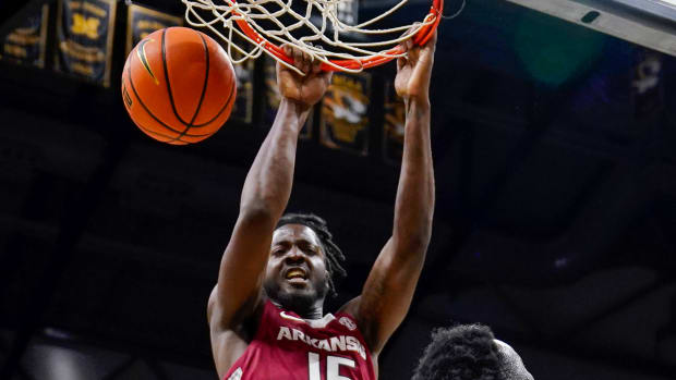 Razorbacks' Makhi Mitchell delivers a dunk against Missouri